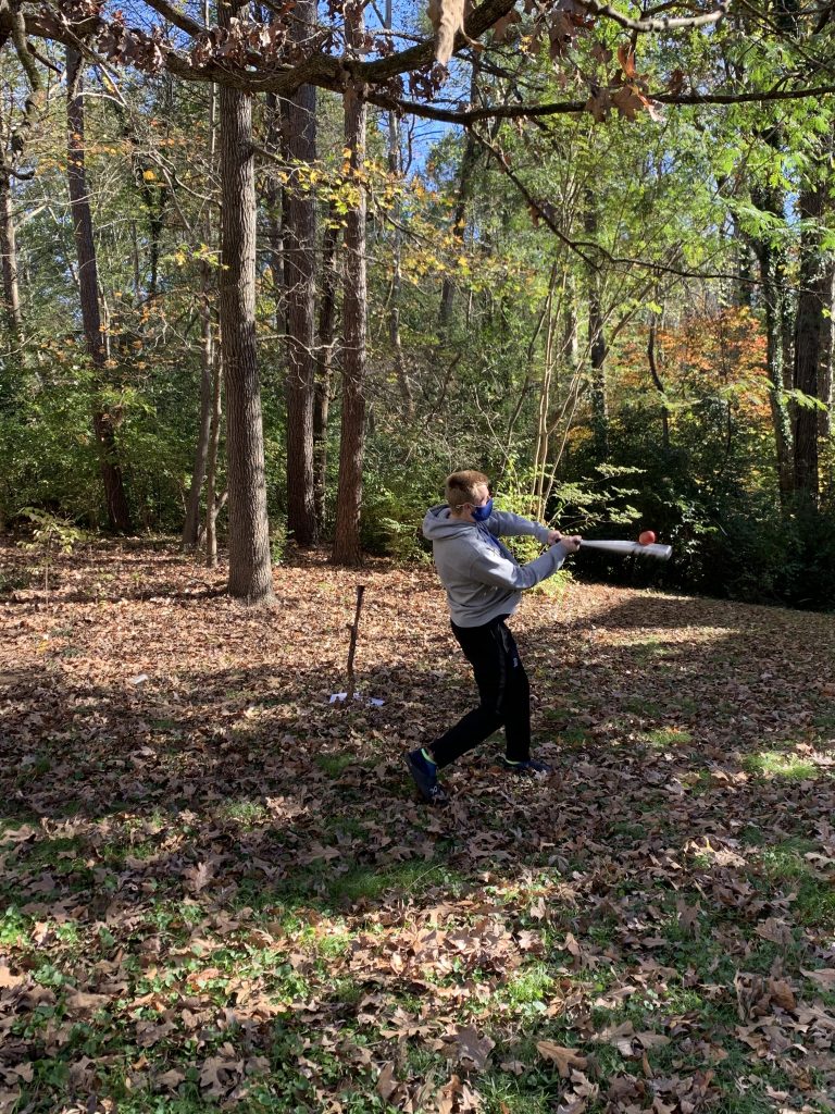 Student smashing apple